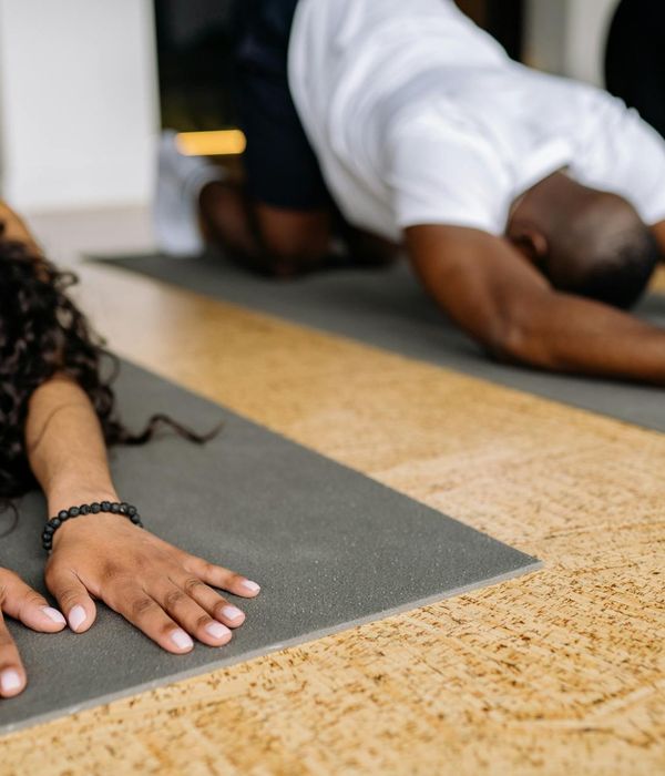 Group of diverse people in a relaxing yoga pose.